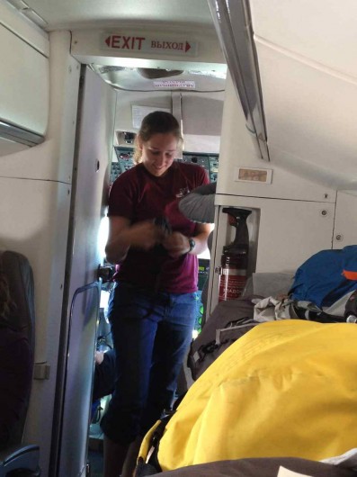 Lindsey Parkinson of Western Washington University exits the cockpit on our final flight to Cherskiy. 