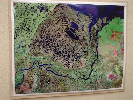 The larger view shows the delta of the Kolyma River from satellite imagery.