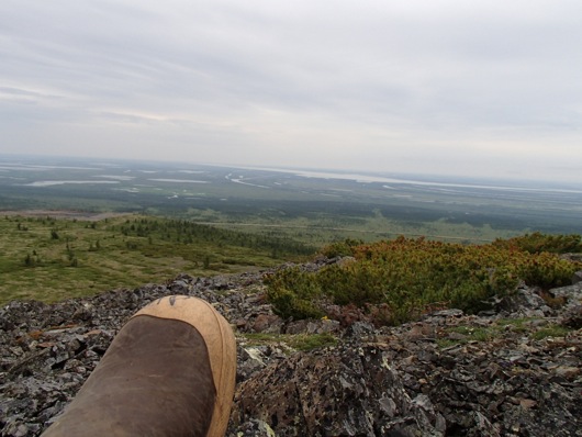 My left boot in front of the view down to the Kolyma River.