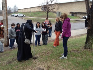 Soil sampling outside of Harding High School with an environmental science classroom as a part of a collaboration to share about Arctic research.