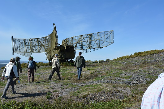 The crew checking out the old radio satellite on Rodinka Mountain.