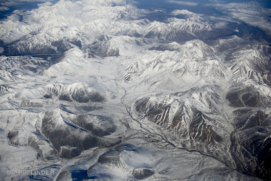 Flying over snow-capped Siberian wilderness. Winter is coming.