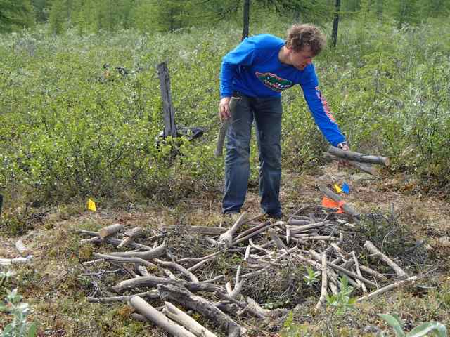 Nakita Zimov scatters the fuel on a high severity burn plot.