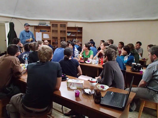 Max Holmes leads an after-breakfast debriefing to cover the agenda for the day.