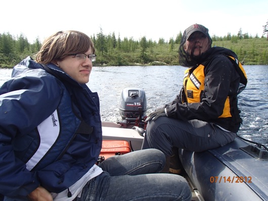Vasily Lebedev and Dr. Karen Frey boat out to the sampling site on Shuch’ye Lake.