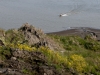 A small boat delivers a research team to Duvannyi Yar.
