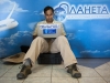 Professor Sudeep Chandra checks email while waiting for the flight.