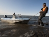 Nikita Zimov pulls one of the small boats ashore.